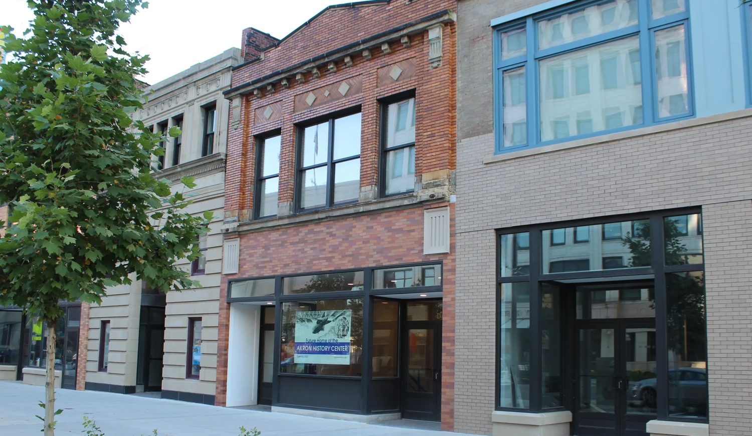 Photo of facade of Akron History Center and surrounding buildings