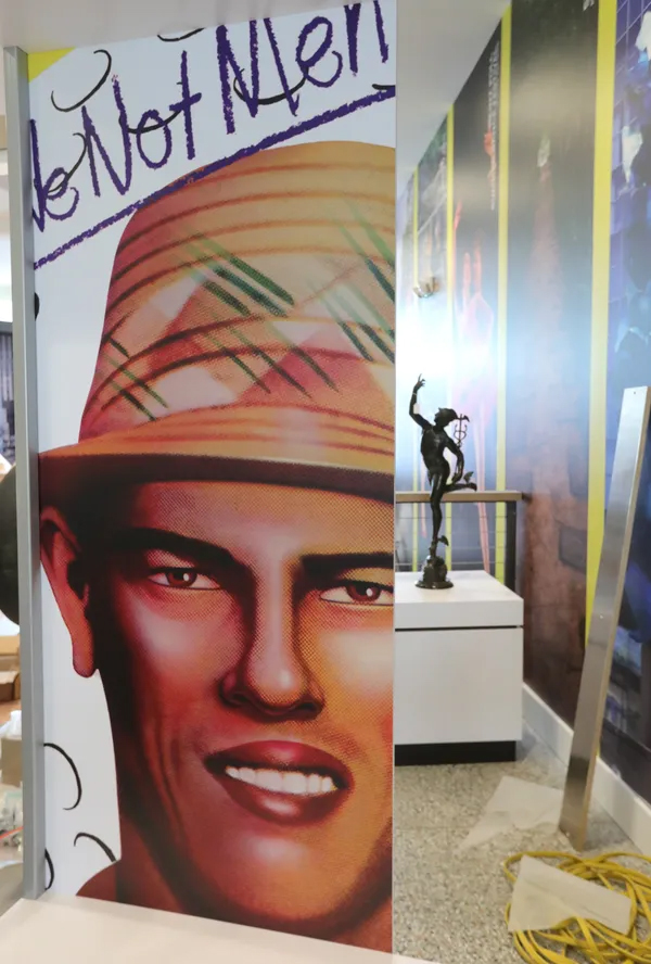 Work continues at the Akron History Center on South Main Street. A giant reproduction of the 1978 cover of Devo's debut album is being installed as a salute to the Akron Sound. In the background is a wing-footed statue of Mercury. PHIL MASTURZO, AKRON BEACON JOURNAL