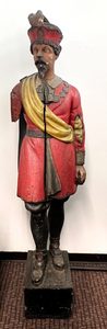The statue of Sir Walter Raleigh that stood outside the Hamilton Cigar Store, 1871-1929.